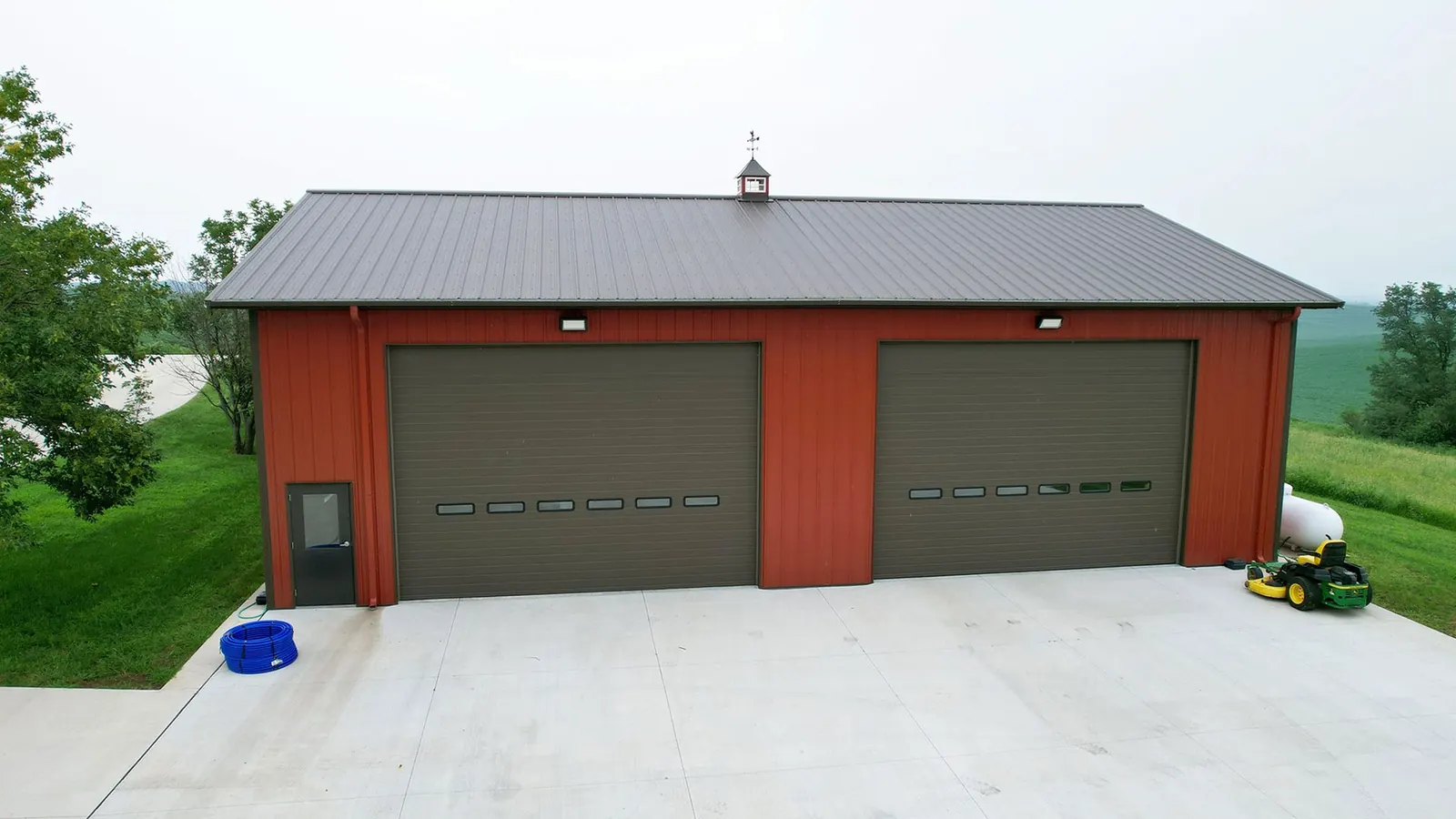 Detached post-frame garage with two overhead doors