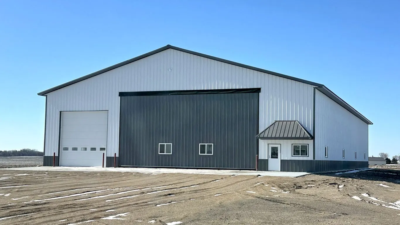 Machine shed with a full-height sliding door for equipment