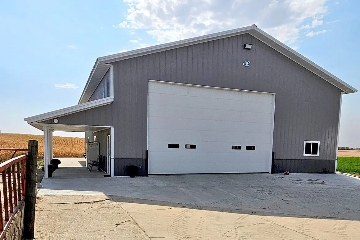 Farm shop with tall overhead doors and a lean-to
